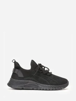 Sale La Modeuse Baskets running en maille ajourée Noir