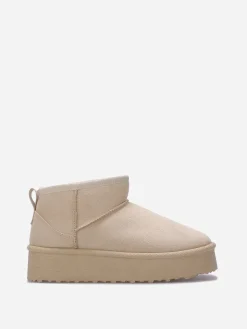 La Modeuse Boots fourrées à plateforme Beige