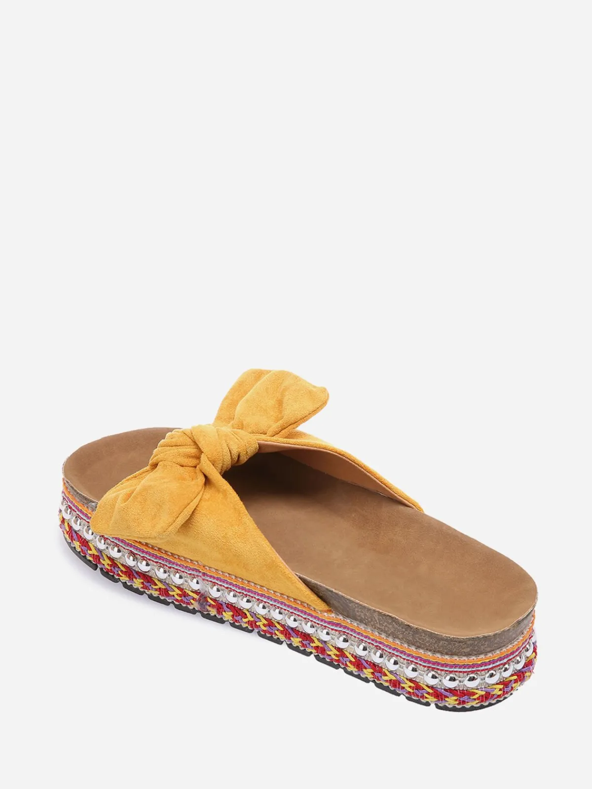 New La Modeuse Mules à noeud et semelle à motifs Jaune