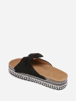 New La Modeuse Mules à noeud et semelle à motifs Noir