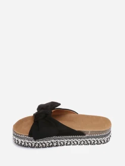 New La Modeuse Mules à noeud et semelle à motifs Noir