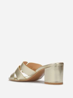 La Modeuse Mules à talon et brides entrecroisées Doré