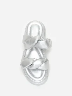 La Modeuse Mules crantées  à brides matelassées Argenté