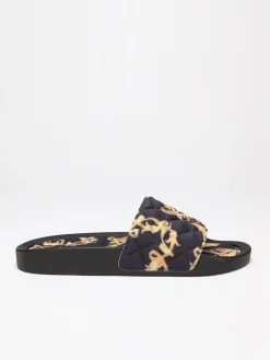 New La Modeuse Mules matelassées à imprimé baroque Noir