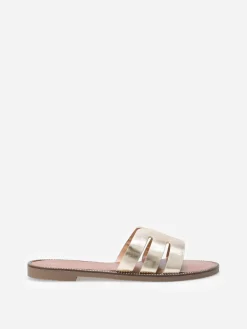La Modeuse Mules plates à bride ajourée et clous Doré