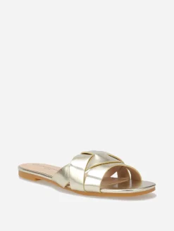 New La Modeuse Mules plates à brides entrecroisées Doré